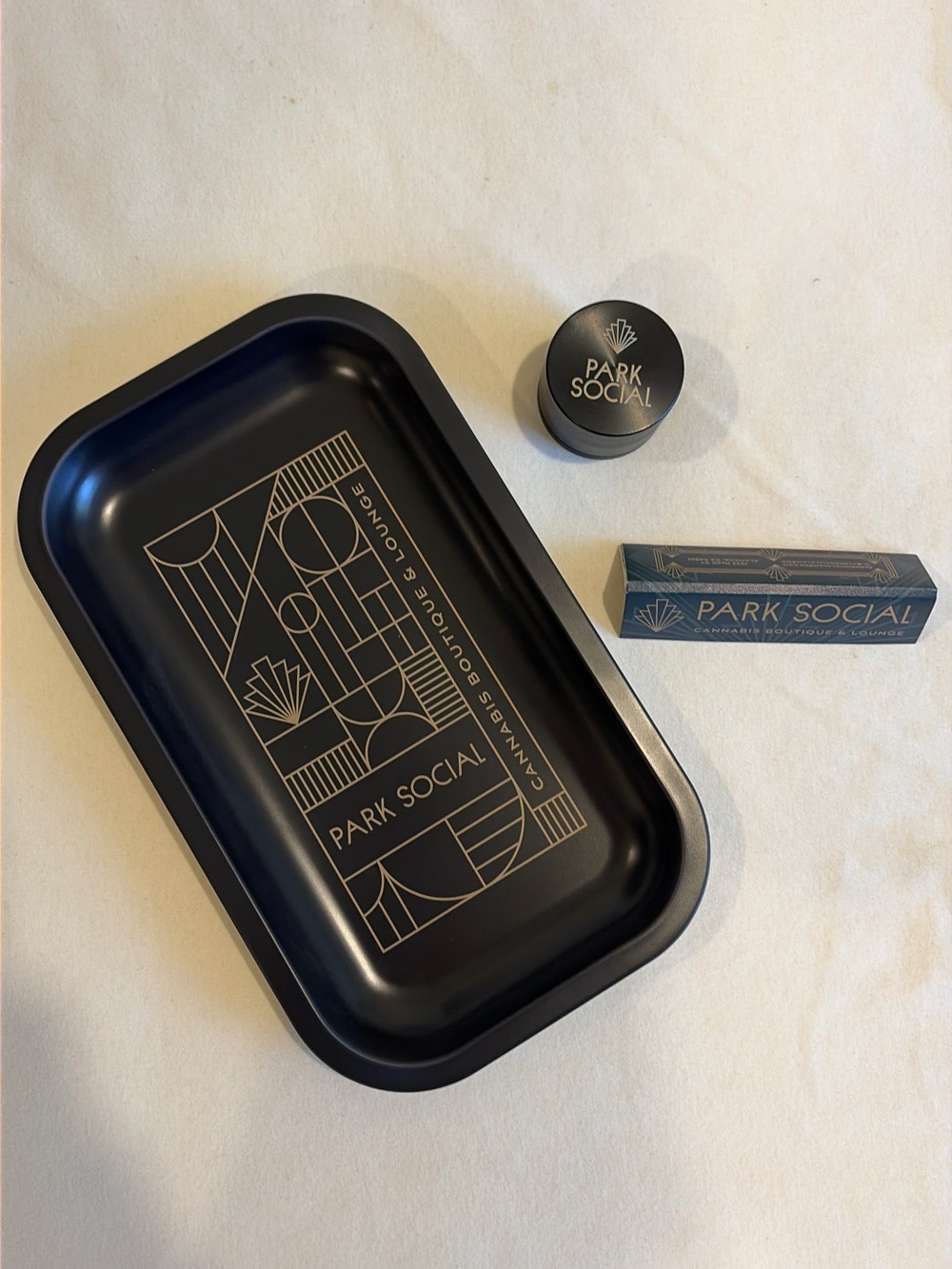 Park Social Cannabis Boutique & Lounge Metal Rolling Tray Set in Black and Gold